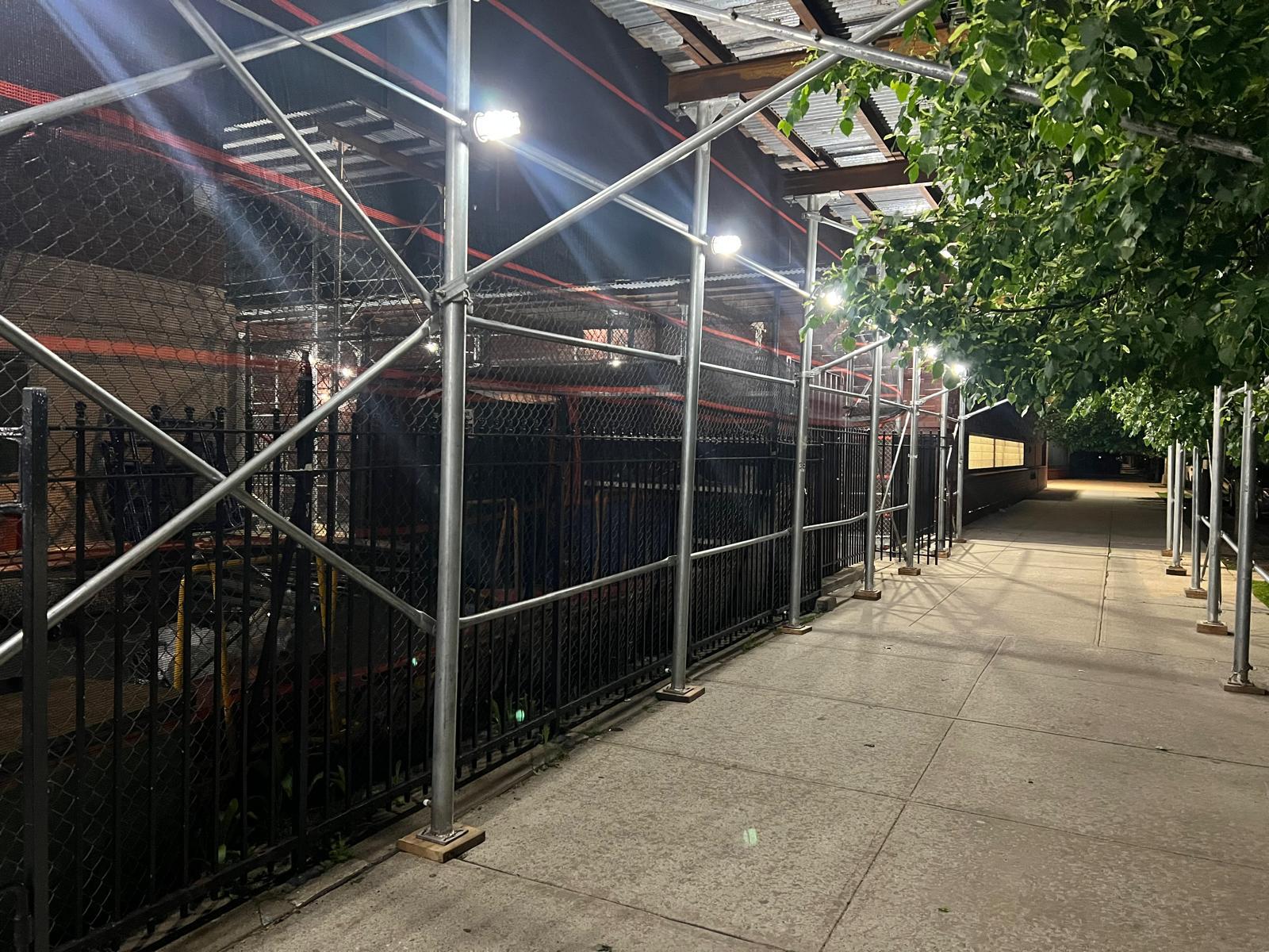 High-rise building wrapped in pipe scaffolding in New York City